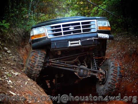1995 Ford Bronco - This 1995 Ford Bronco is captured mid-climb on a challenging off-road trail.