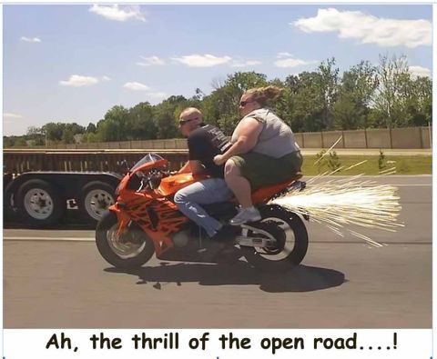 1971 Ford Ranchero - Two people ride a motorcycle, creating a trail of sparks as they go.
