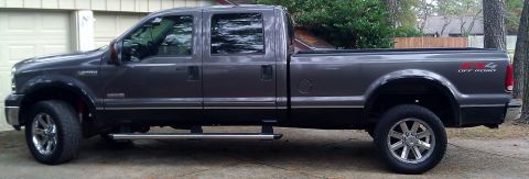 2006 Ford F-350 - This 2006 Ford F-350 crew cab pickup truck is shown in a side profile, FX4 Off Road badging on the rear fender.