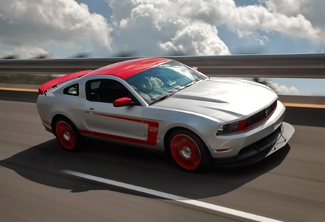 2012 Ford Mustang - The optional Laguna Seca Package includes race-compound tires, an aggressive front air splitter and rear pedestal spoiler, standard Torsen…