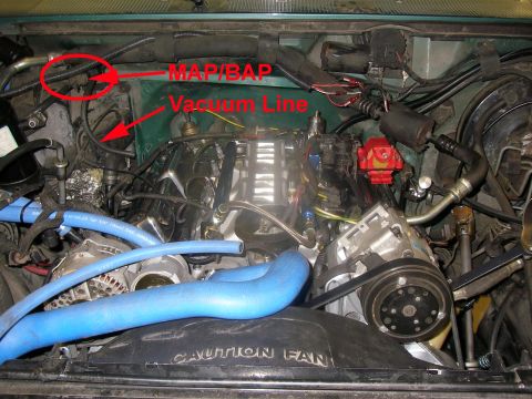 1990 Ford Bronco - Annotated engine bay showing MAP/BAP sensor and vacuum line locations above a V6, with blue upper radiator hose and fan shroud.