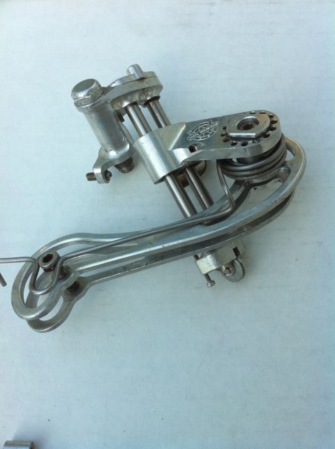 2010 Hyundai Genesis - A close-up view of a vintage bicycle rear derailleur, showing its intricate mechanical components.