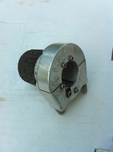 2010 Hyundai Genesis - A close-up view of a motorcycle throttle assembly, showing the 'LMDS' branding and patent pending information.