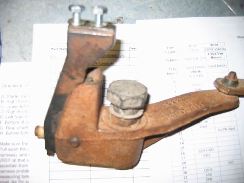1992 Ford Bronco - Close-up of a rusty transfer case component, likely for a Ford Bronco.