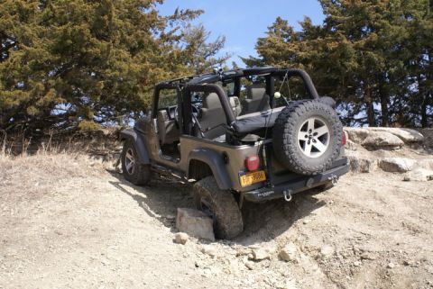 2005 Jeep Wrangler - A Jeep Wrangler navigates a rocky, off-road trail.