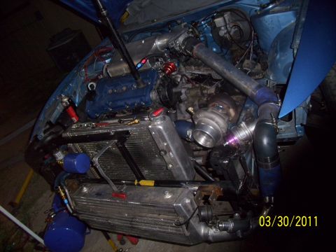 1995 Ford Probe - Custom engine bay modifications visible, including a turbocharger and intercooler setup. The date 03/30/2011 is visible.