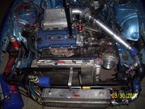 1995 Ford Probe - Customized engine bay with turbocharger and intercooler, dated 03/30/2011.