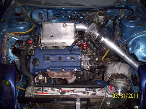 1995 Ford Probe - Custom engine bay modifications including a turbocharger and intercooler piping are visible.