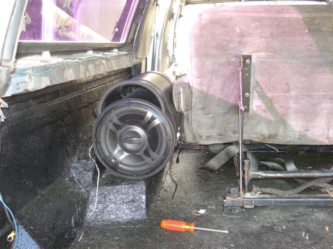 1992 Ford C-350 (Centurion Conversions) - Vehicle interior with aftermarket speakers installed and a screwdriver on the floor.