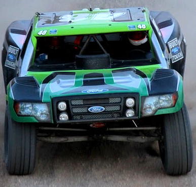 1996 Ford Bronco - This off-road truck features a prominent Ford grille and racing decals.