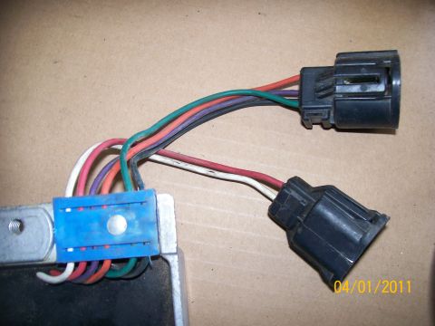 1970 Ford Bronco - Close-up of a wiring harness and electronic module with multiple colored wires and connectors visible.