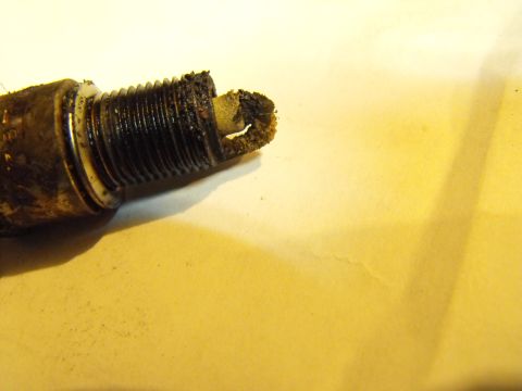 1983 Chrysler Fifth Avenue - Pulled this plug out of the passenger's rear cylinder. The engine was effectively a 6 or 7 cylinder as two plugs looked this bad.