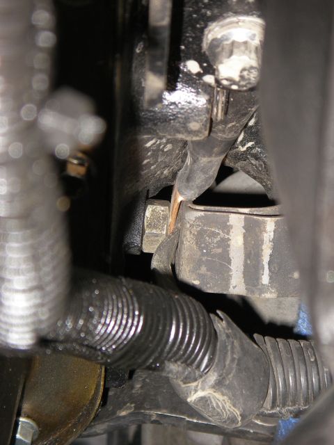 1990 Ford Bronco - Close-up view of engine wiring and a mounting bracket, with no clear year identification.
