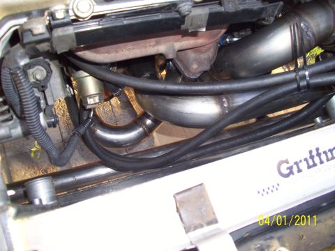 1995 Ford Probe - Custom exhaust piping is visible in the engine bay, with 'Griffin' text on a component below.
