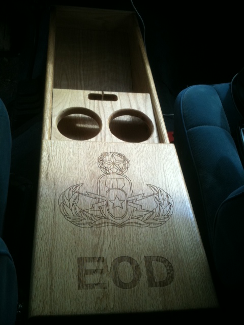 1988 Ford Bronco - Custom wooden center console with EOD insignia and cup holders is installed in a vehicle's interior.