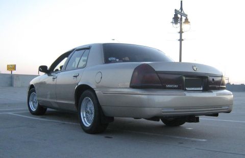2000 Mercury Grand Marquis - Rear view of a 2000 Mercury Grand Marquis sedan with aftermarket wheels.