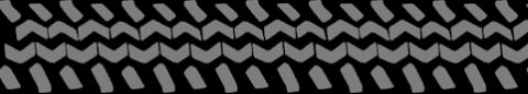 1989 Ford Bronco - A close-up view of a tire tread pattern shows a repeating design of chevron and angled blocks.