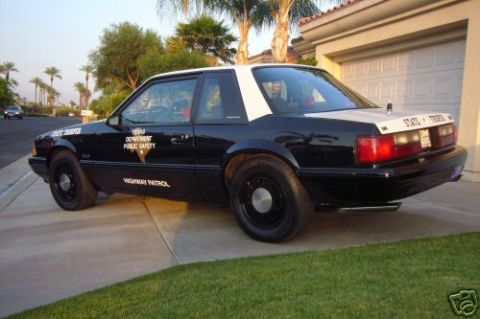 1991 Ford LTD Crown Victoria - Texas Highway Patrol Mustang SSP, a police car model from the late 1980s.