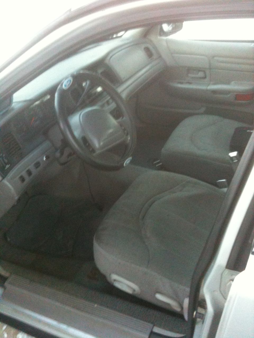 1999 Ford Crown Victoria interior showing front seats and dashboard