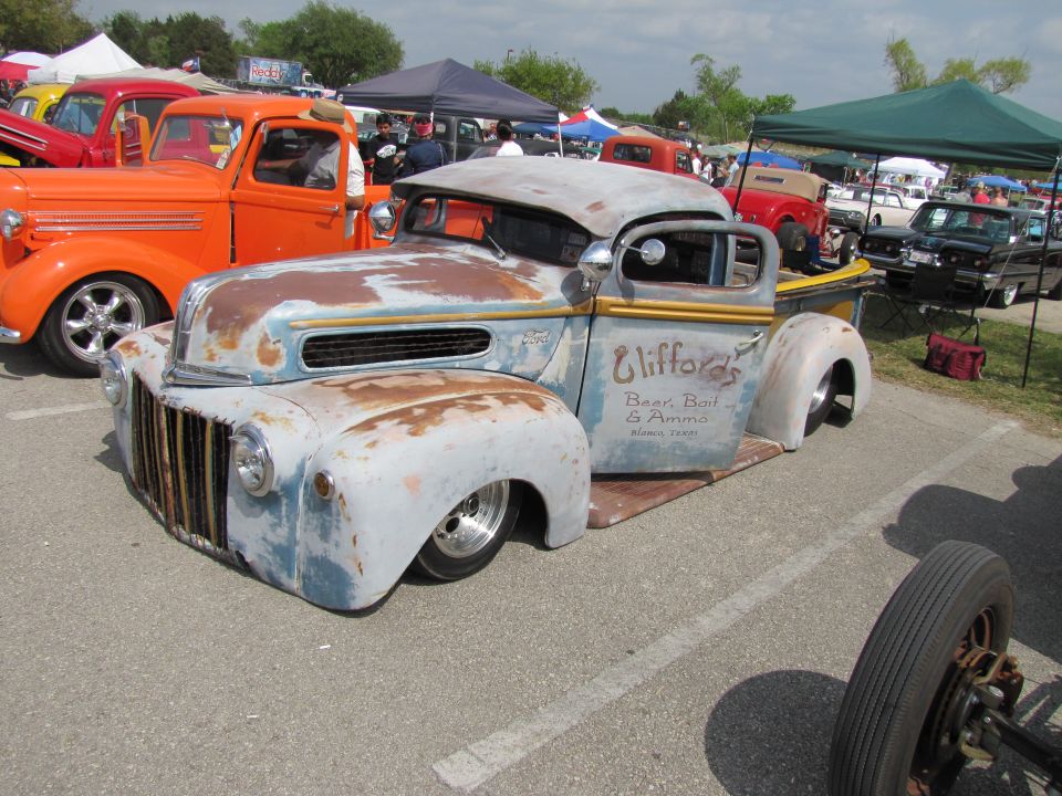 Rat rod pickup truck with "Clifford's Beer, Bait & Amma" text on door
