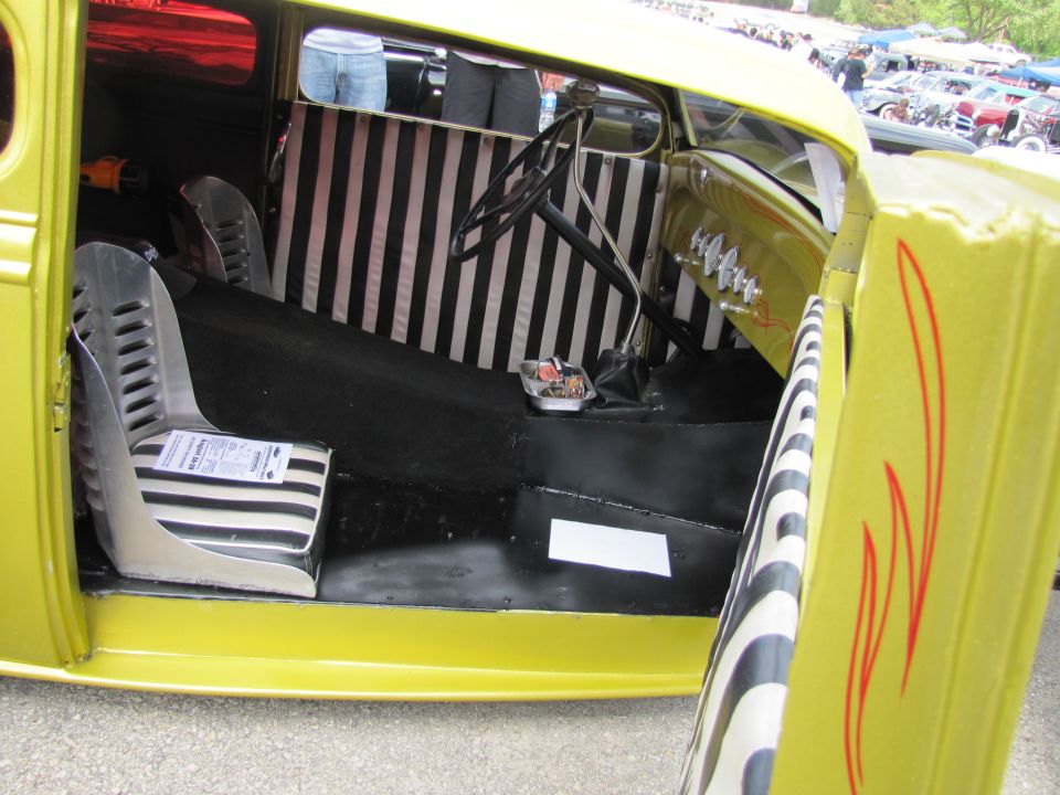 Yellow hot rod interior with striped seats and upholstery