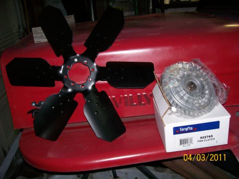 1970 Ford Bronco - Fan clutch and fan blade are displayed on a red surface with "WILLYS" lettering visible.