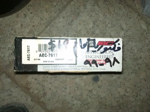 1998 Ford Crown Victoria - A box of NAPA brake pads is shown, with part number AEC-7617 and handwritten markings.