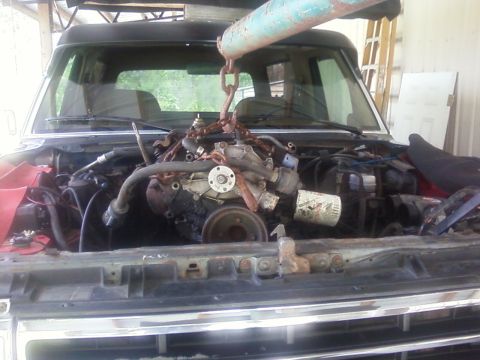 1990 Ford Bronco - Engine removal in progress on a 1990 Ford Bronco.