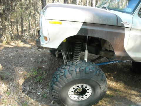 1979 Ford F-150 - Front view of a modified 1979 Ford F-150 pickup truck with large off-road tires and suspension components visible.