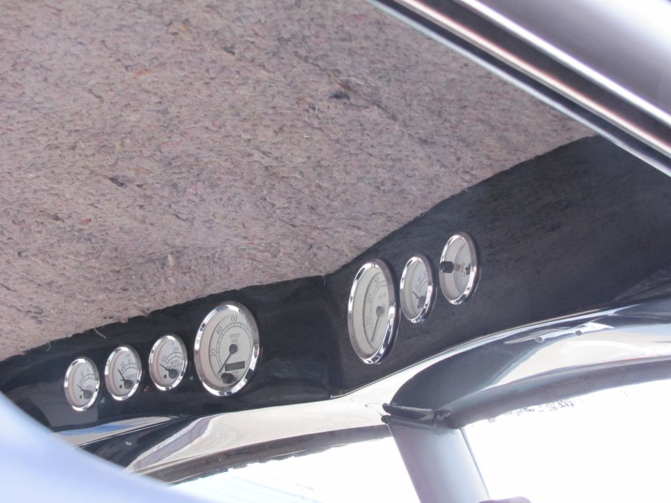 Custom gauges installed on a vehicle's headliner