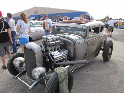 2006 BMW 5 Series - Custom hot rod with a powerful V8 engine on display at an outdoor car show.