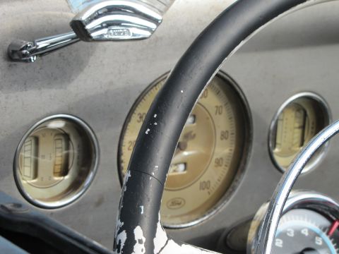 2006 BMW 5 Series - The dashboard features classic gauges and a steering wheel with worn paint.