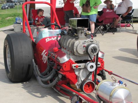 2006 BMW 5 Series - A dragster is shown with its powerful blown V8 engine and large rear tires.