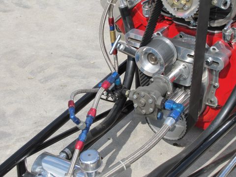 2006 BMW 5 Series - Close-up of a custom engine with braided fuel lines and polished components.