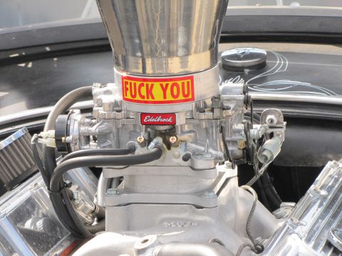 2006 BMW 5 Series - Close-up of a custom engine part with explicit text and branding.