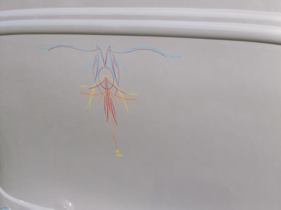 Gray vehicle panel with colorful pinstriping; Supermotors.net logo visible