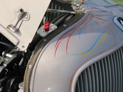 2006 BMW 5 Series - Close-up of a silver hood with custom pinstriping and a vertical grille.