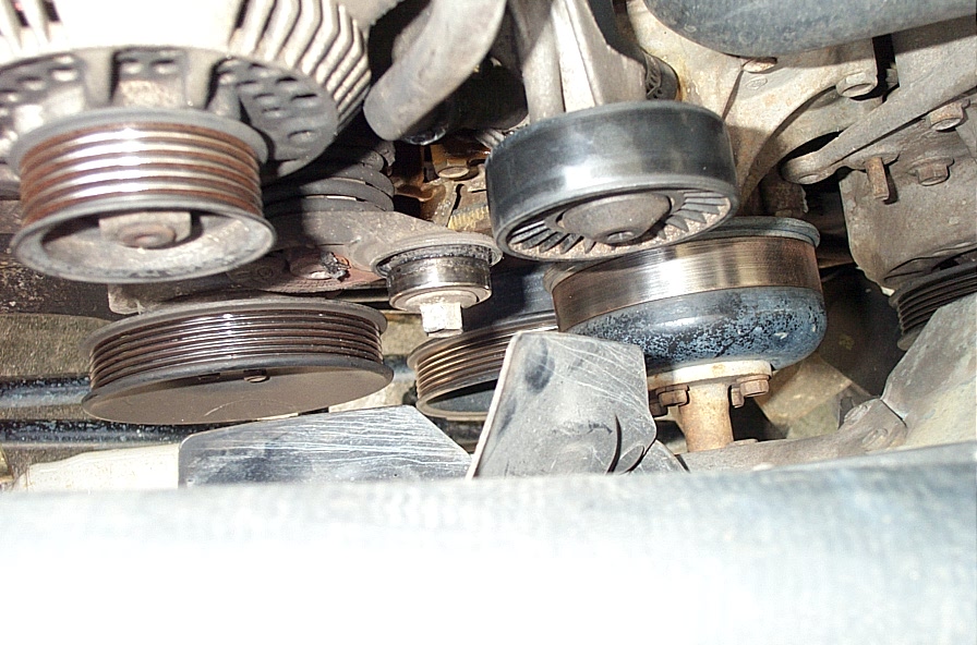 Engine front accessory drive pulleys, idler and tensioner with the serpentine belt removed