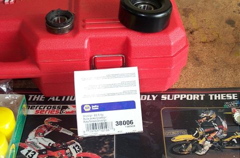 1995 Ford Bronco - A pulley and bearing are shown resting on a red toolbox, next to NAPA Auto Parts packaging.