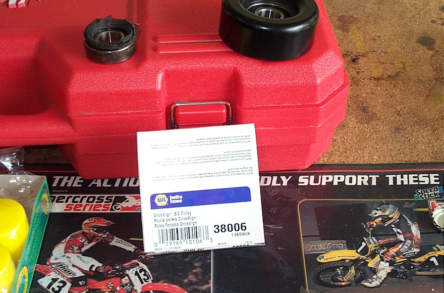 NAPA DriveAlign idler pulley part 38006 with box label on a red tool case