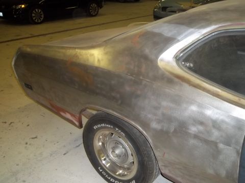 1971 Dodge Dart - A car body, possibly a 1970s Mopar, is shown in primer, with another dark car in the background.