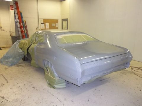 1971 Dodge Dart - A 1971 Dodge Dart is prepared for painting in a workshop, with masking paper covering most of its body.