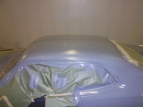 1971 Dodge Dart - The car's roof and upper body are covered in protective plastic sheeting, indicating preparation for a paint job.