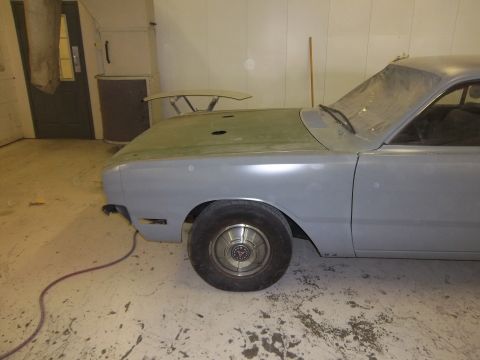 1971 Dodge Dart - This 1971 Dodge Dart is in primer and appears to be undergoing restoration, a spoiler mounted on the hood.