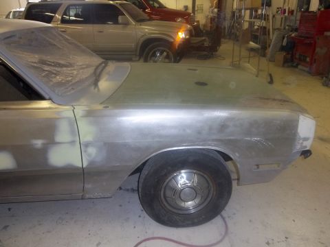 1971 Dodge Dart - A car is being prepped for paint in a workshop, with other vehicles visible in the background.