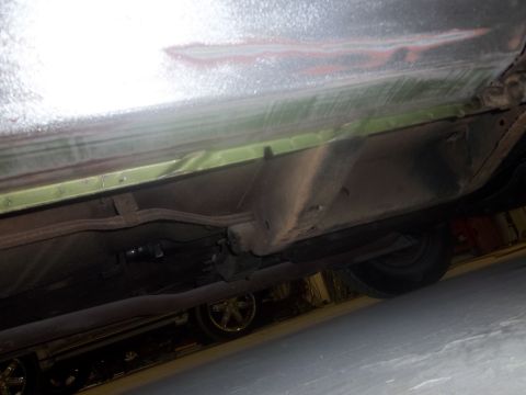 1971 Dodge Dart - Underside view of a car, focusing on the frame and suspension components.
