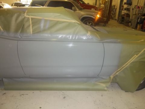 1971 Dodge Dart - A car is covered in masking paper and tape, likely for painting, with other vehicles visible in the garage setting.