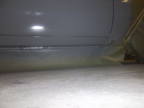 1971 Dodge Dart - Car door bottom edge covered in primer, taped off for painting.