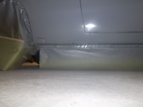 1971 Dodge Dart - A vehicle is covered in protective plastic sheeting, obscuring most of its details.