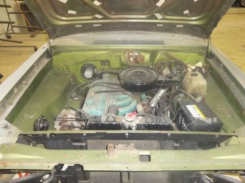 1971 Dodge Dart - The engine compartment of a classic car, showing the inline-6 engine and associated components.